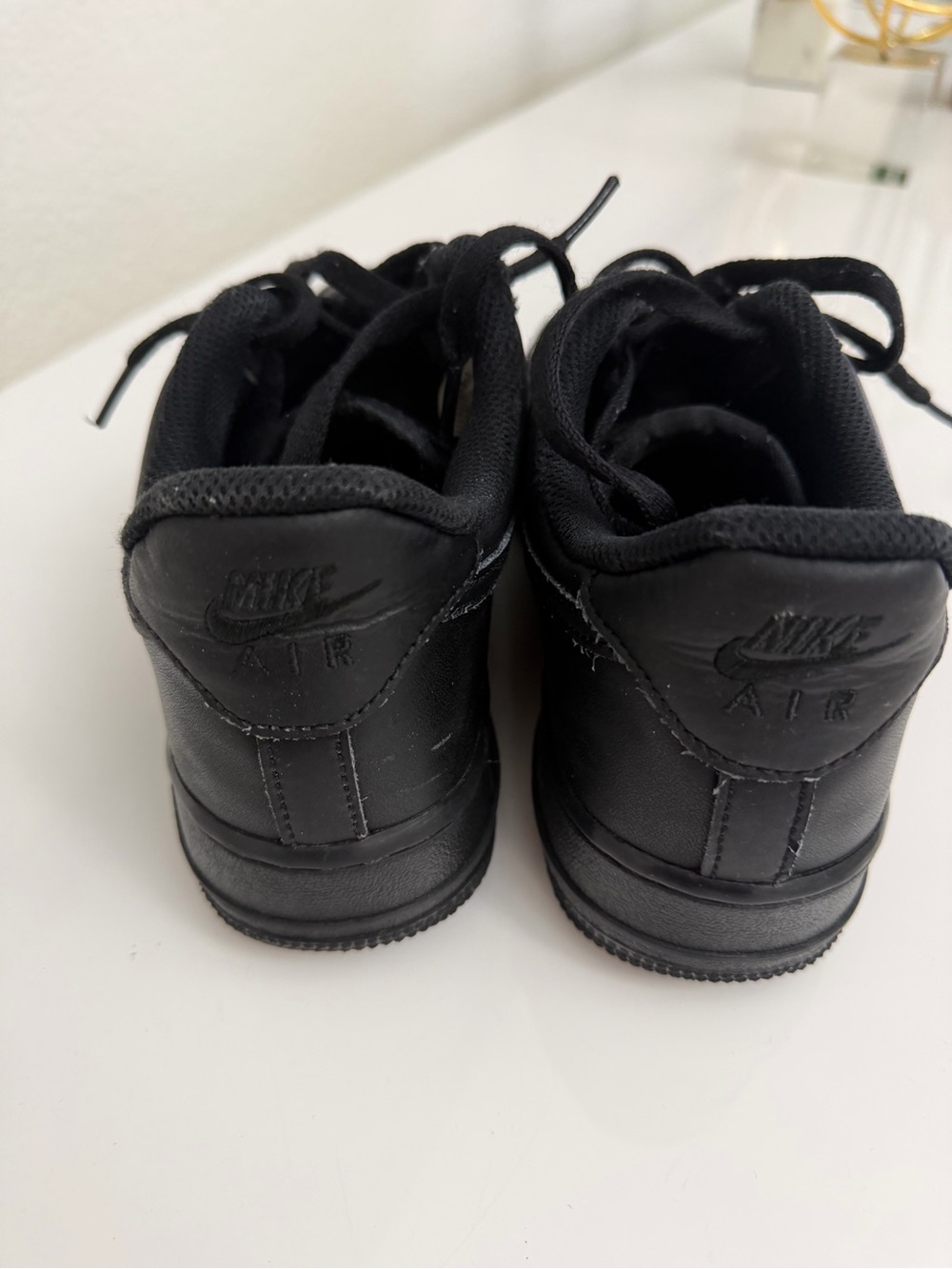 Nike Kids All-Black Air Leather Sneakers